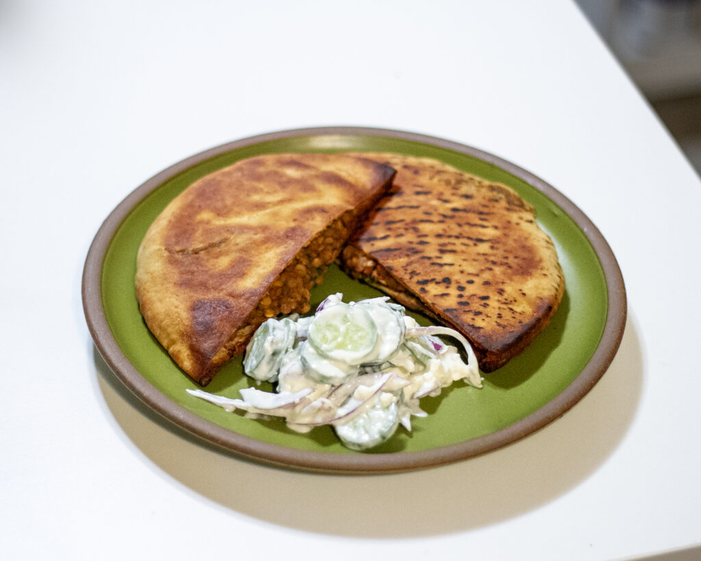 Spiced lentil and walnut pita pockets with creamy cucumber salad from Cooks Illustrated
